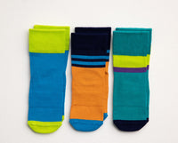 Clint kids socks: three color-block socks in blue, orange and teal. Squid Socks, the brand seen on Shark Tank.