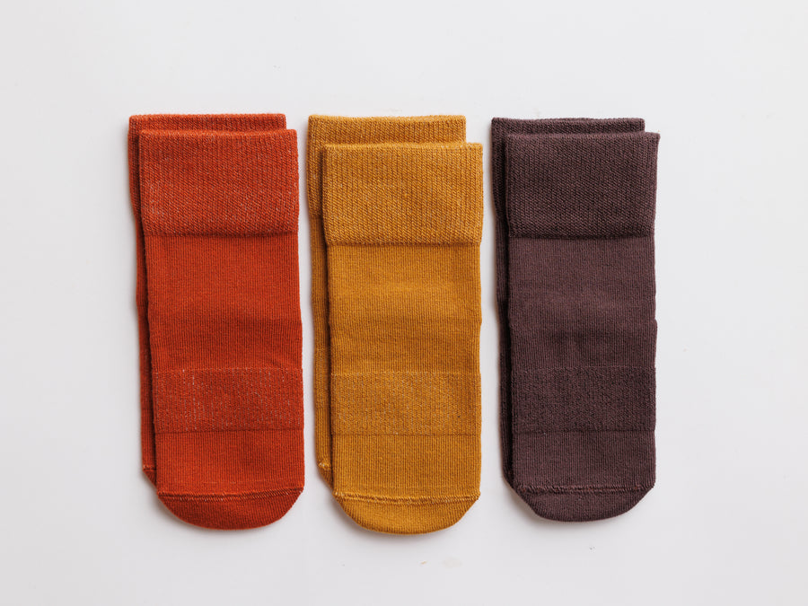 Cedar kids socks: three socks in rust, mustard and dark brown. Squid Socks, the brand seen on Shark Tank.