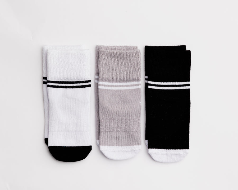 City kids socks: three striped-cuff socks in white, gray and black. Squid Socks, the brand seen on Shark Tank.