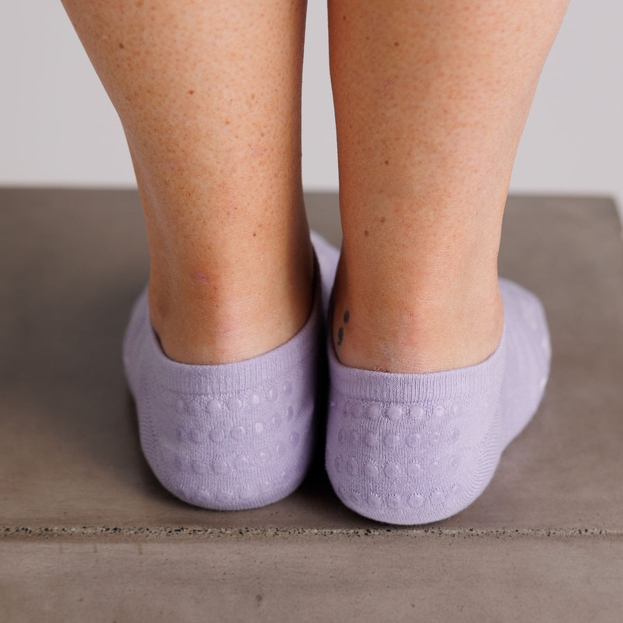 Rear view of lavender no-show grip socks showing the heel grip dots. By Squid Socks.
