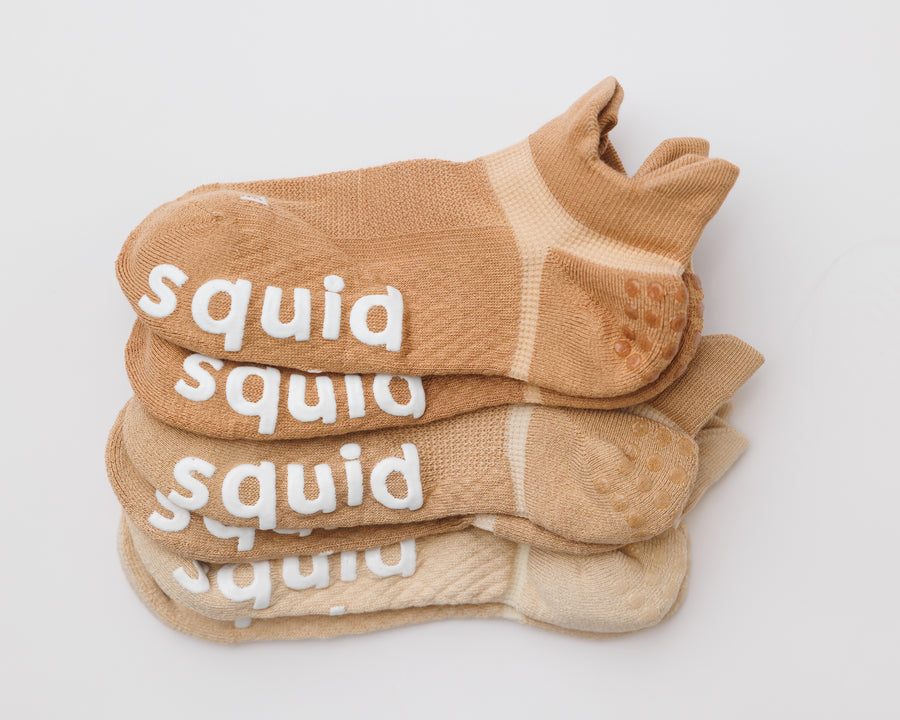Caffeinated ankle grip socks in brown, tan, and cream, stacked to show all three colors. By Squid Socks.