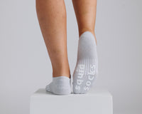 Thumbnail for Gray no-show grip socks with one sole raised to show white bottom grips. By Squid Socks.