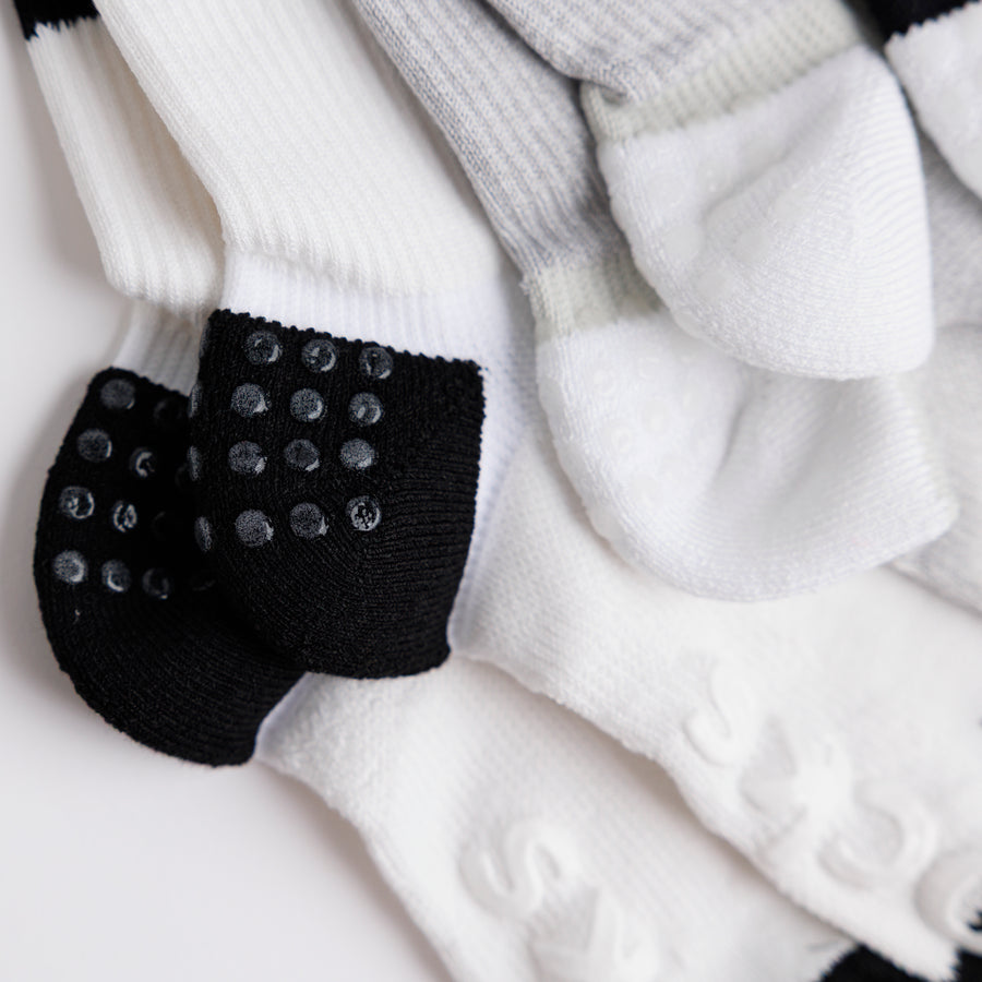Close-up of Retro crew socks showing heel grip dots and raised bottom grips. By Squid Socks.