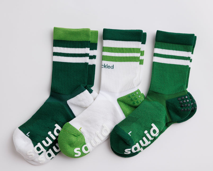 Pickle Pack crew pickleball grip socks in green and white combinations, arranged flat with striped cuffs visible. By Squid Socks.