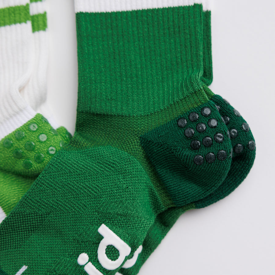 Close-up of green Pickle Pack crew pickleball socks showing grip dots on the heel panels. By Squid Socks.