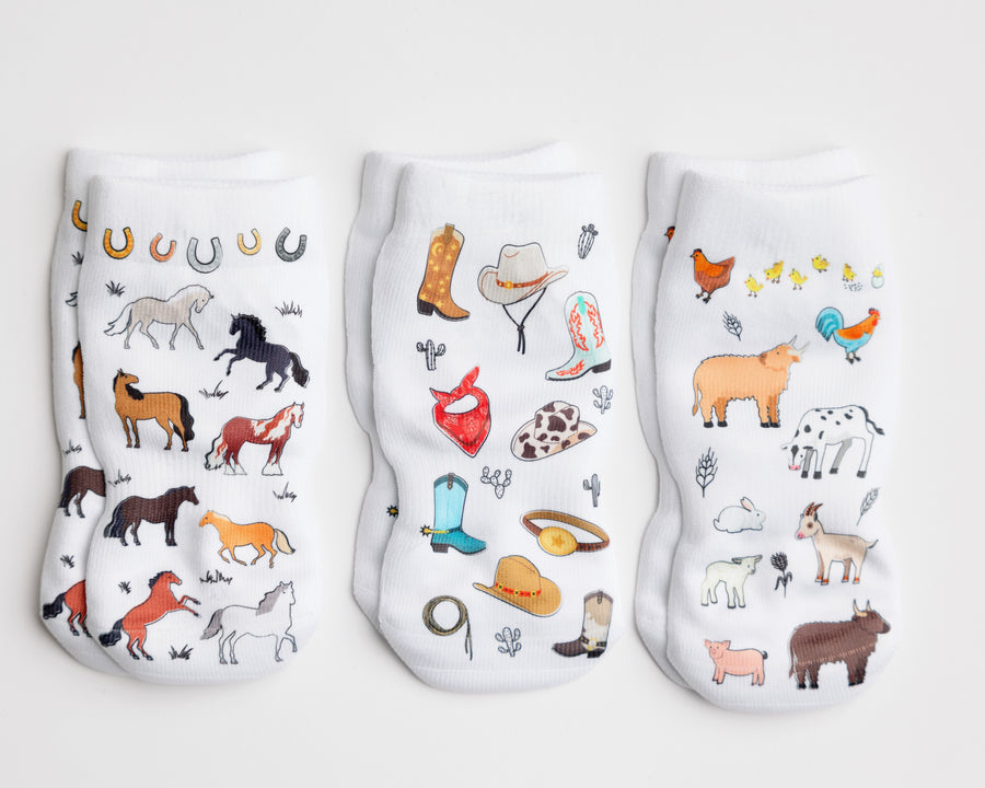 Cowboy kids socks: three socks with horse, western accessory and farm animal prints. Squid Socks, the brand seen on Shark Tank.
