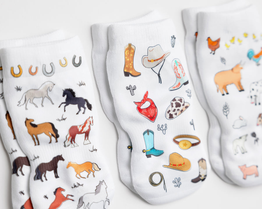 Cowboy kids socks: close-up of horse and western accessory prints. Squid Socks, the brand seen on Shark Tank.