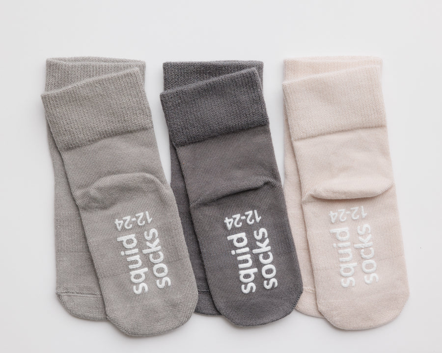 Classic kids socks: neutral socks showing cuff dots and branded sole grips. Squid Socks, the brand seen on Shark Tank.