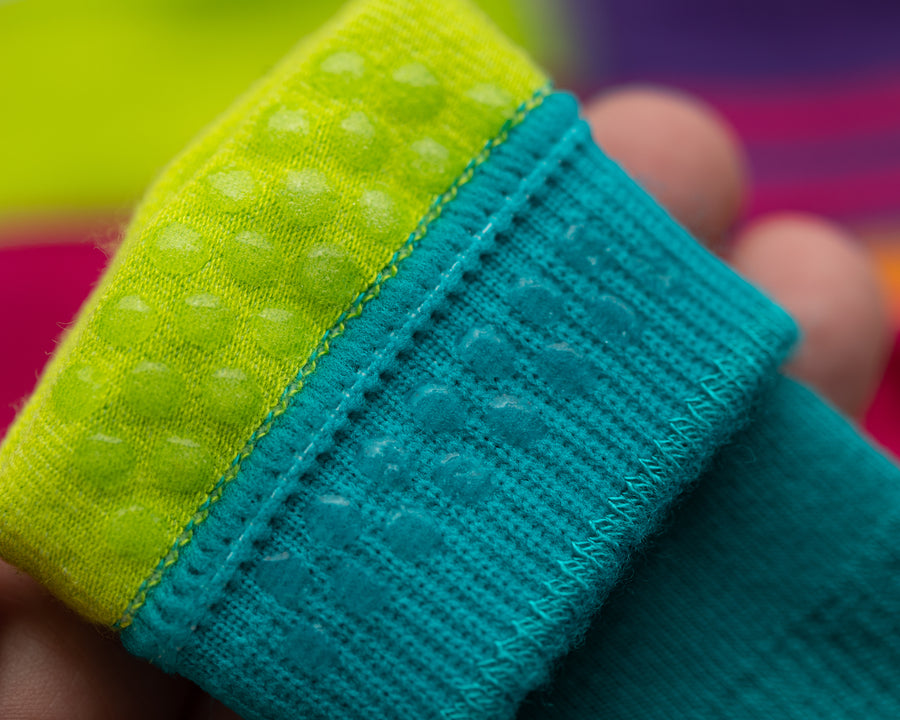 CeCe kids socks: close-up of neon grip dots inside a teal cuff. Squid Socks, the brand seen on Shark Tank.