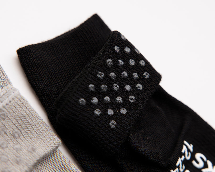 Charlie kids socks: close-up of silicone dots inside a black cuff. Squid Socks, the brand seen on Shark Tank.