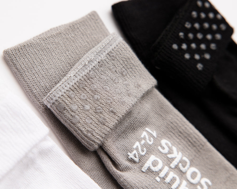 Charlie kids socks: close-up of gray cuff dots and sole grips. Squid Socks, the brand seen on Shark Tank.