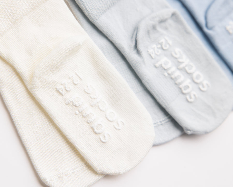 Casen kids socks: close-up of ivory and blue sole grips. Squid Socks, the brand seen on Shark Tank.