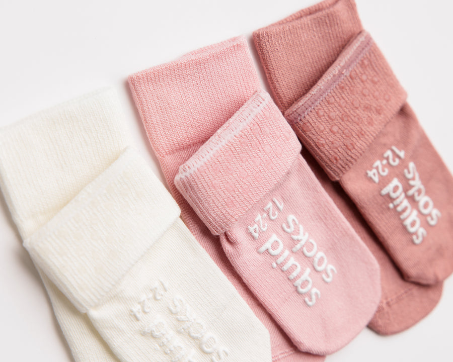 Claire kids socks: close-up of pink and rose cuff dots and sole grips. Squid Socks, the brand seen on Shark Tank.