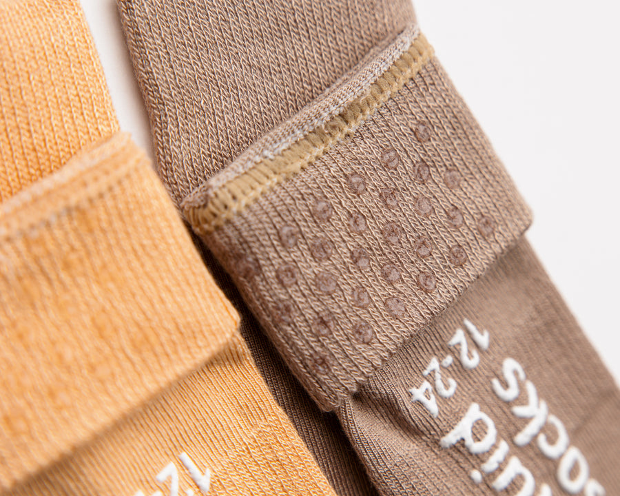 Caramel kids socks: close-up of brown cuff dots and sole grips. Squid Socks, the brand seen on Shark Tank.