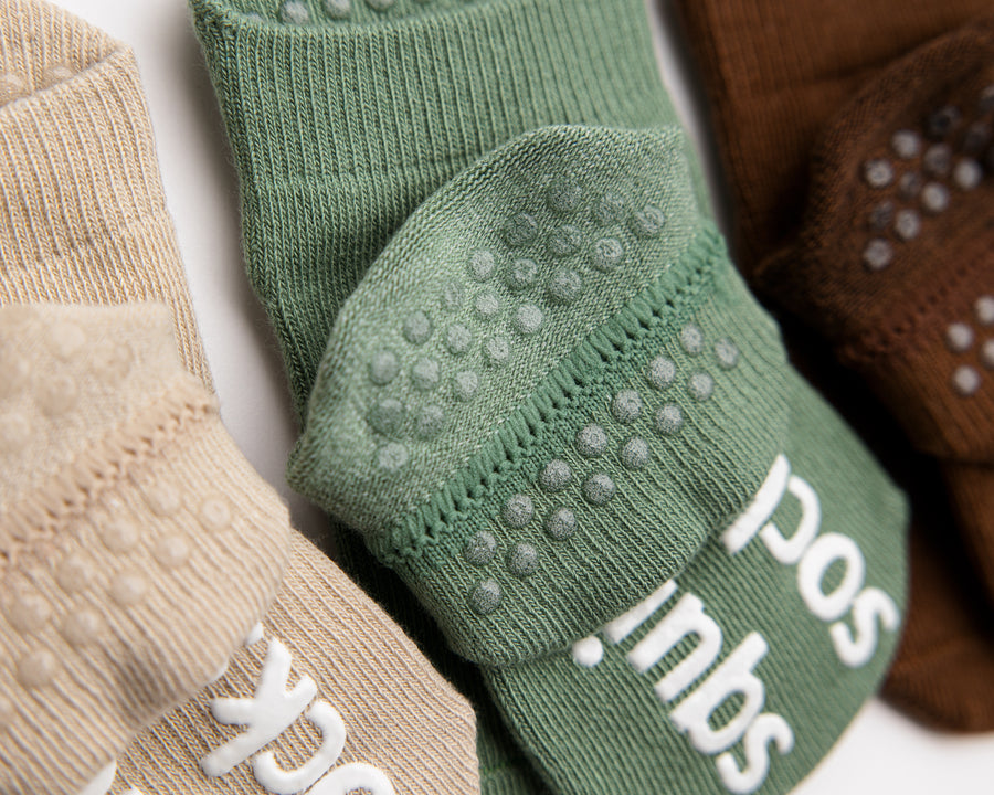 Chai ankle socks: close-up of green cuff dots and sole grips. Squid Socks, the brand seen on Shark Tank.