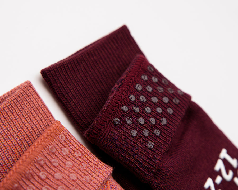 Courtney cotton crew socks: close-up of silicone dots inside rose and burgundy cuffs. Squid Socks, the brand seen on Shark Tank.