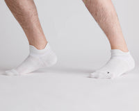 Thumbnail for White ankle grip socks worn in a wide stance, showing side views. By Squid Socks.