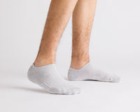 Thumbnail for Gray no-show grip socks worn with heels raised, showing side views. By Squid Socks.