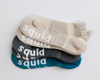 Driftline ankle grip socks in beige, charcoal gray, and teal, stacked to show all three colors. By Squid Socks.