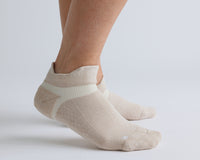 Thumbnail for Beige ankle grip socks worn on both feet, showing side views. By Squid Socks.