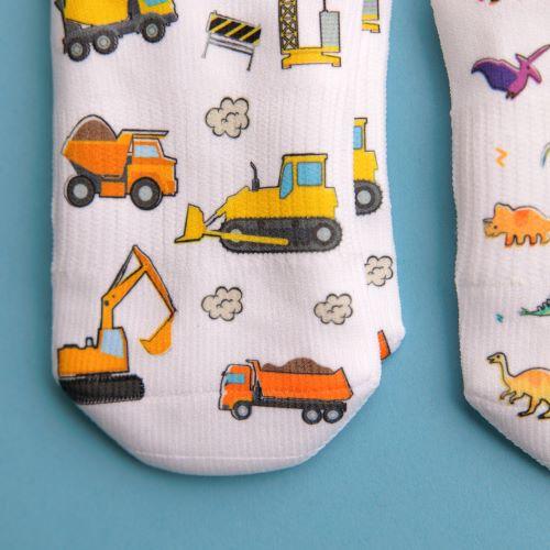 Cohen kids socks: construction vehicles printed on white socks. Squid Socks, the brand seen on Shark Tank.