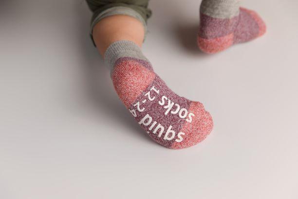 Chris cotton crew socks: close-up of gray-cuff socks showing sole grips. Squid Socks, the brand seen on Shark Tank.