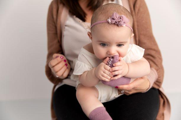 Cami kids socks: adult holding a baby wearing lavender socks. Squid Socks, the brand seen on Shark Tank.