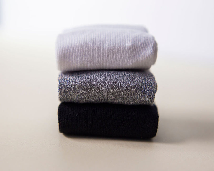 Crew ankle socks: stack of white, gray and black ankle socks. Squid Socks, the brand seen on Shark Tank.