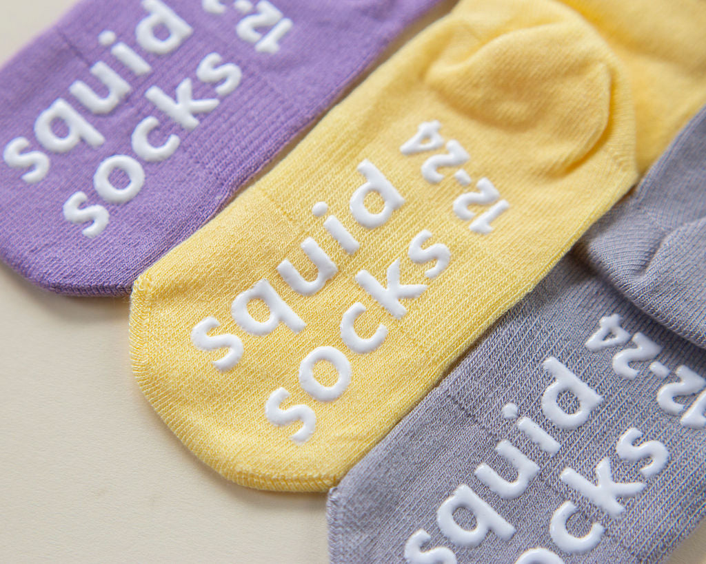 squid socks baby socks shark tank seen on tv socks that stay on grip socks baby newborn infant toddler child children kid kids crawl walk run feet toes best quality durable soft gentle good deal sale sales bamboo cotton polyester blend made in america american small business woman women entrepreneur baby shower easter christmas holiday gift winter warm snug neutral girl yellow purple gray bright solid plain simple casual crew ankle lace pretty