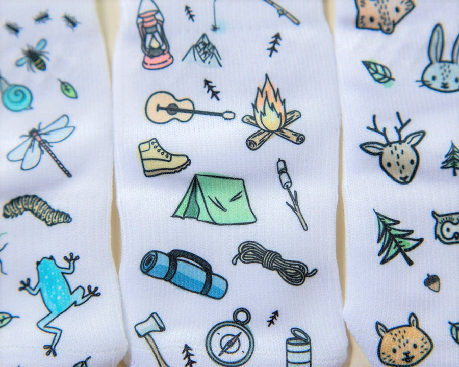 Camping kids socks: close-up of camping gear, bug and woodland animal prints. Squid Socks, the brand seen on Shark Tank.