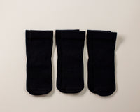 Coal kids socks: three solid black socks laid flat. Squid Socks, the brand seen on Shark Tank.