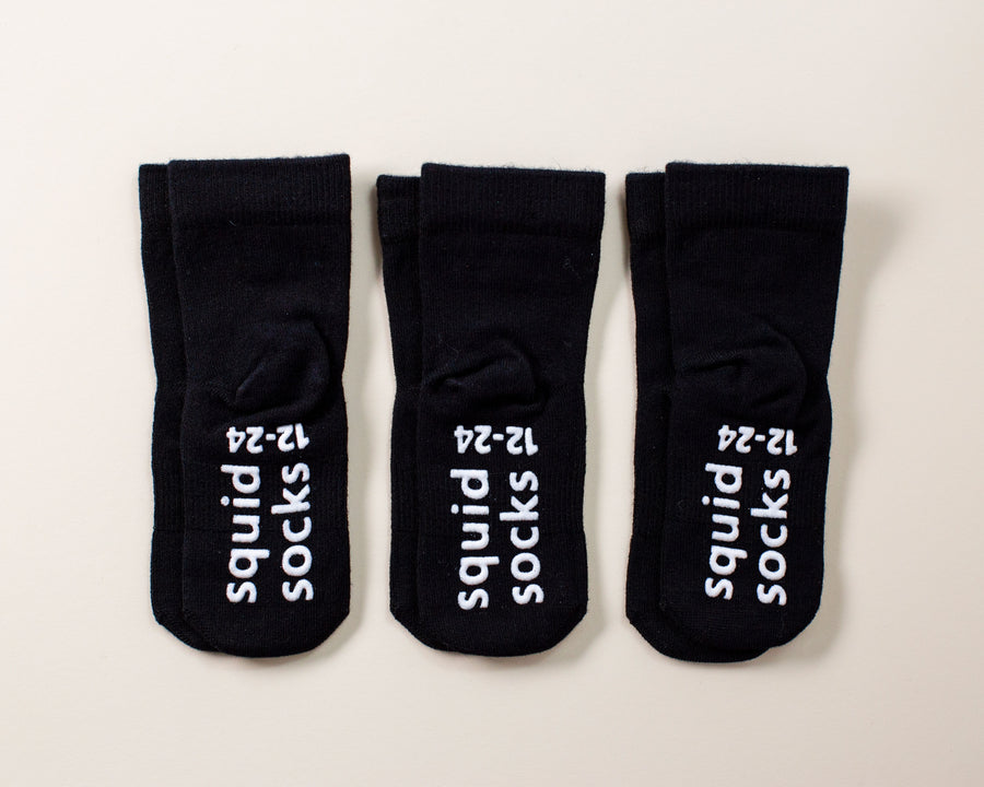 Coal kids socks: three black socks with branded sole grips. Squid Socks, the brand seen on Shark Tank.