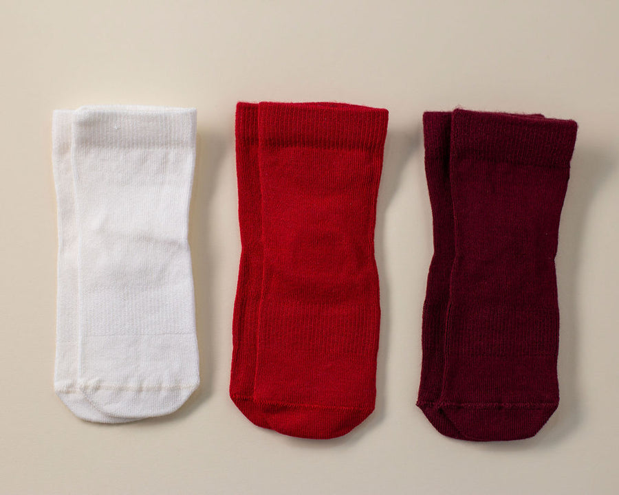 Channing kids socks: three red, cream and wine-colored socks laid flat. Squid Socks, the brand seen on Shark Tank.