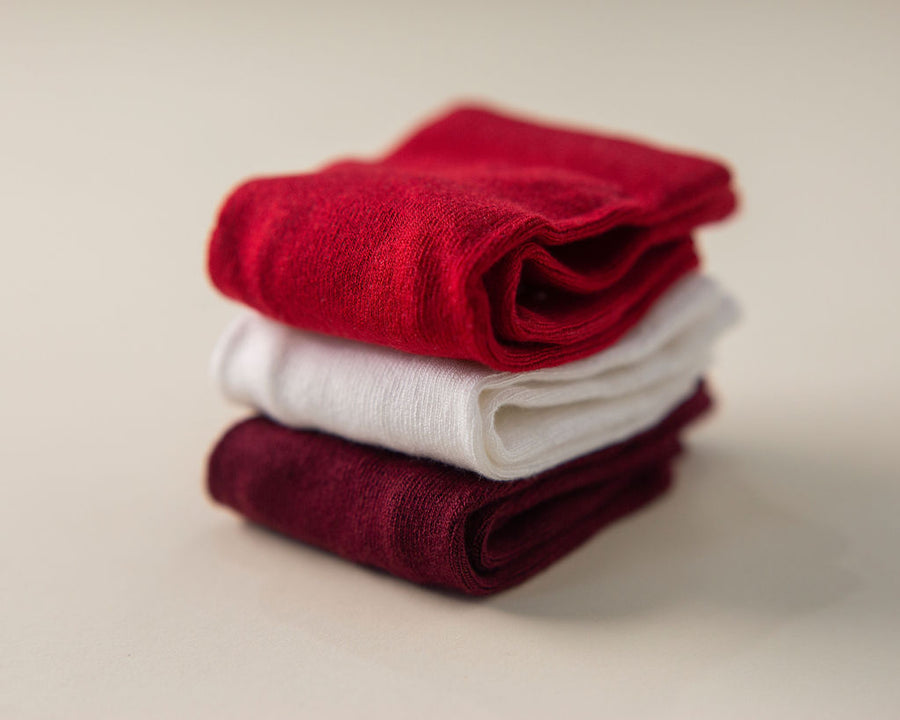 Channing kids socks: red, cream and wine-colored socks stacked. Squid Socks, the brand seen on Shark Tank.