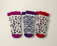 Chanel kids socks: three animal-print socks with magenta, purple and red cuffs. Squid Socks, the brand seen on Shark Tank.
