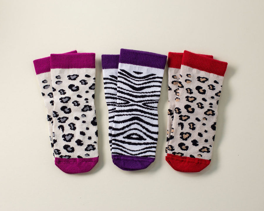 Chanel kids socks: three animal-print socks with magenta, purple and red cuffs. Squid Socks, the brand seen on Shark Tank.