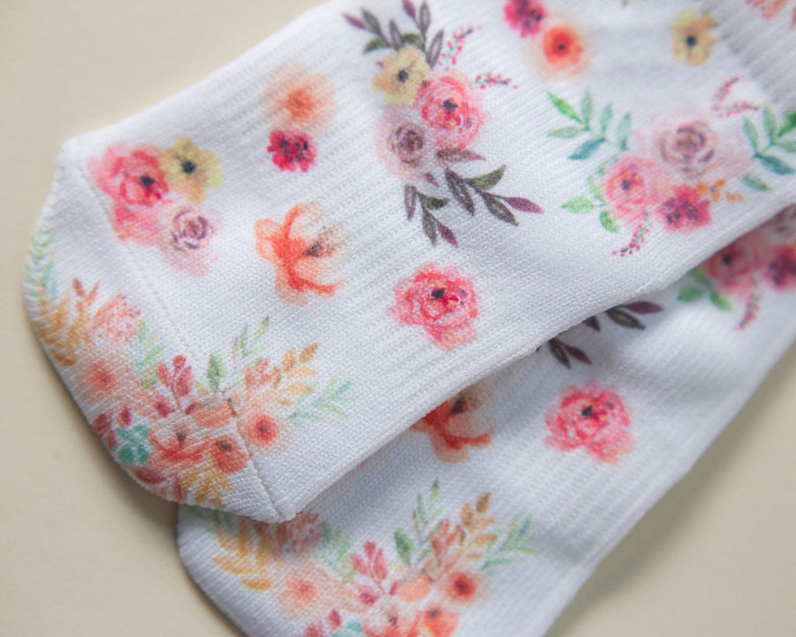 Chloe kids socks: close-up of floral-print socks. Squid Socks, the brand seen on Shark Tank.