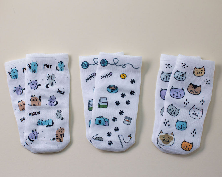 Meow kids socks: three socks with cats, cat toys and cat-face prints. Squid Socks, the brand seen on Shark Tank.