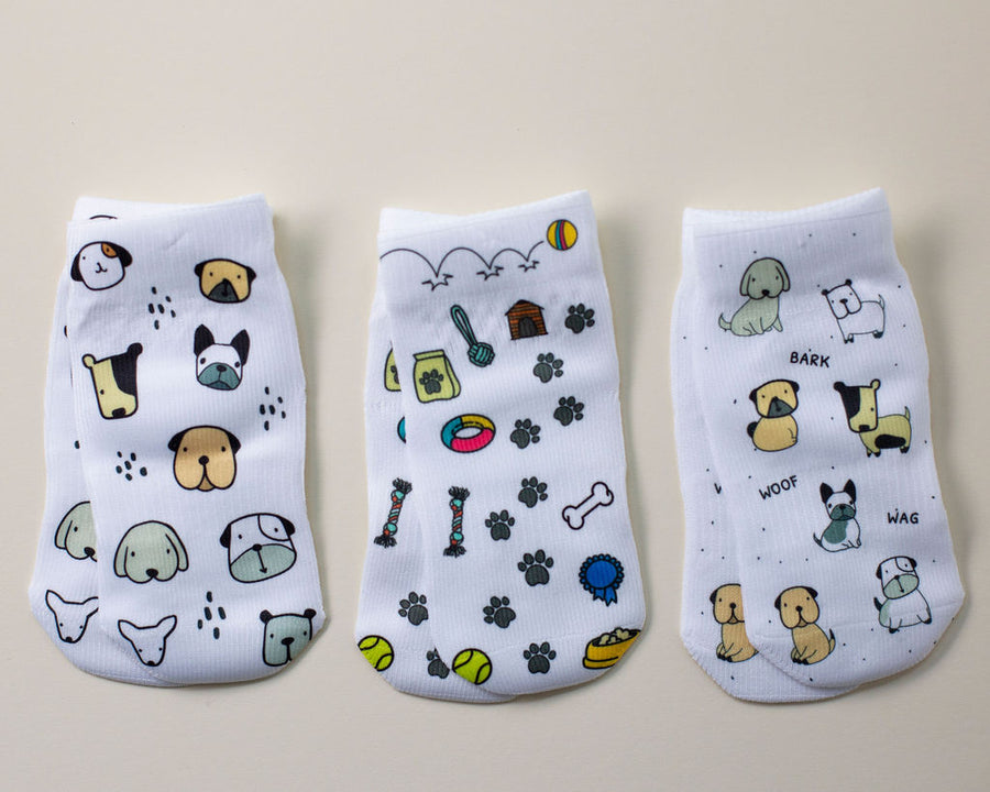 Woof kids socks: three socks with dogs, dog faces and pet toy prints. Squid Socks, the brand seen on Shark Tank.