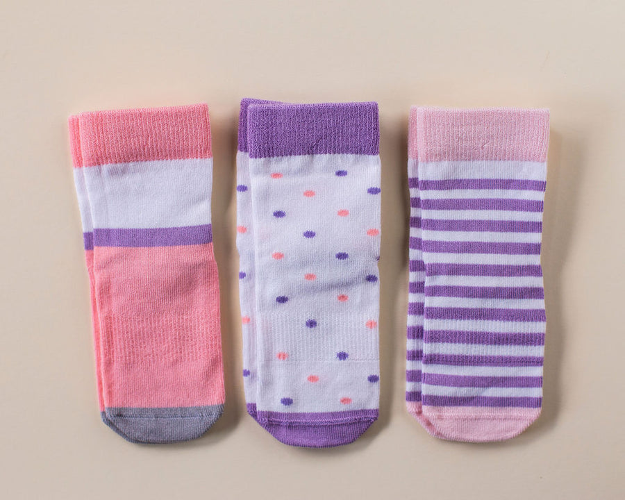 Caroline kids socks: pink and purple socks laid flat. Squid Socks, the brand seen on Shark Tank.