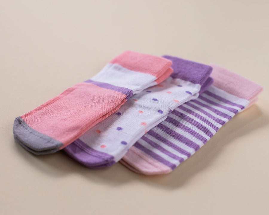 Caroline kids socks: three pink and purple color-block, dotted and striped socks. Squid Socks, the brand seen on Shark Tank.