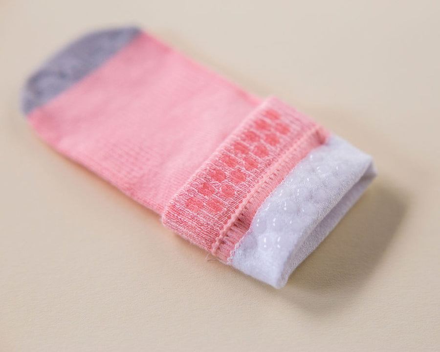 Caroline kids socks: close-up of pink silicone dots inside a cuff. Squid Socks, the brand seen on Shark Tank.
