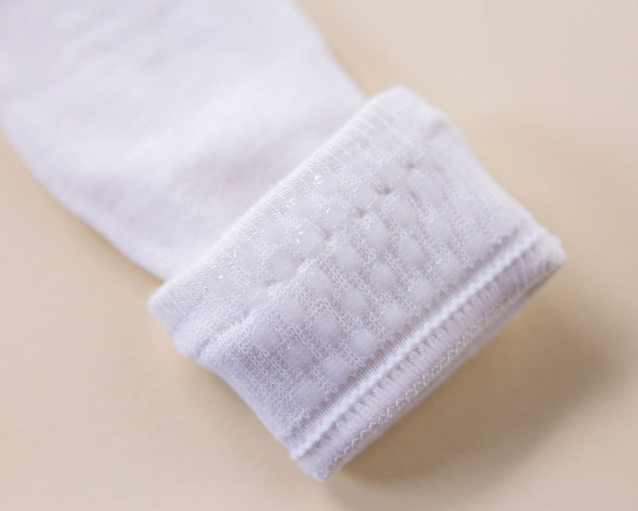 Comfort kids socks: close-up of silicone dots inside a white cuff. Squid Socks, the brand seen on Shark Tank.