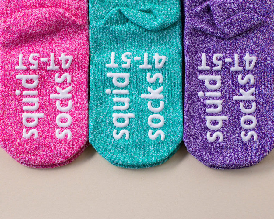 Clarissa ankle socks: pink, teal and purple ankle socks showing sole grips. Squid Socks, the brand seen on Shark Tank.