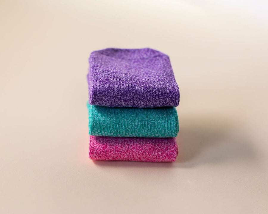 Clarissa ankle socks: stack of purple, teal and pink ankle socks. Squid Socks, the brand seen on Shark Tank.